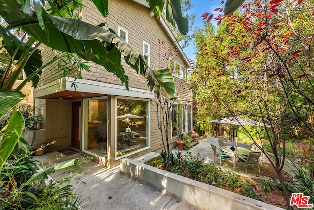 view of home's exterior featuring a patio area