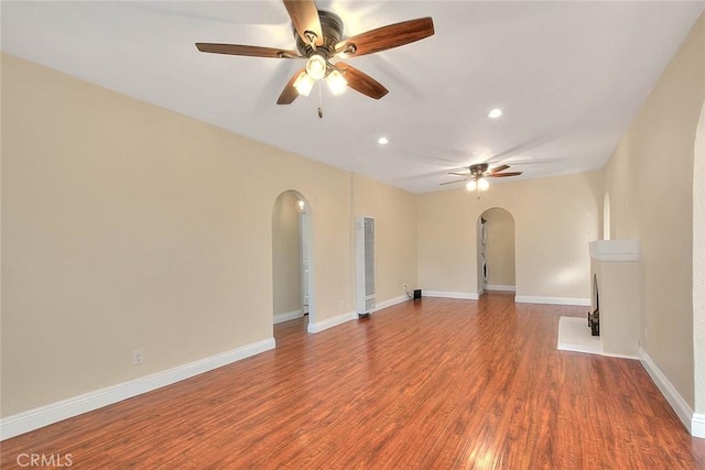 spare room featuring ceiling fan and wood-type flooring