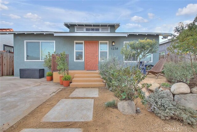 view of front of property featuring a patio