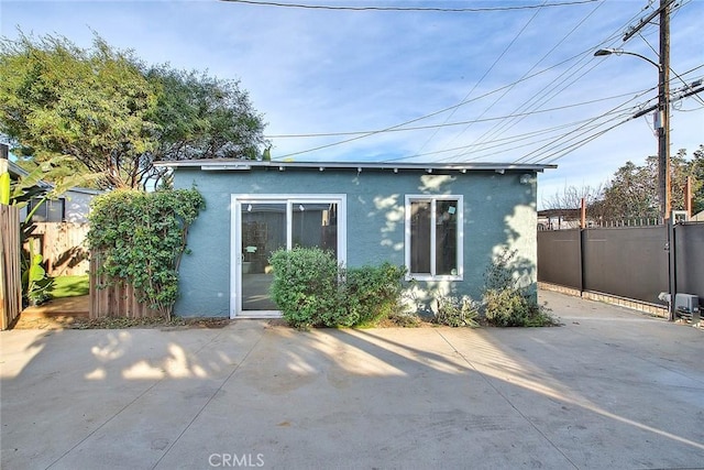 rear view of house featuring a patio