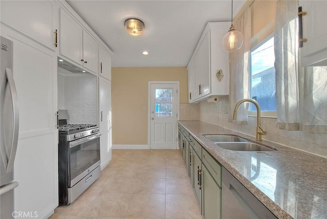 kitchen featuring sink, pendant lighting, white cabinets, and white appliances