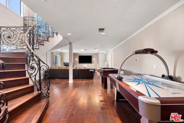 game room featuring wood-type flooring, billiards, and ornamental molding