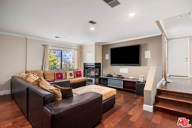 living room with dark hardwood / wood-style floors and crown molding