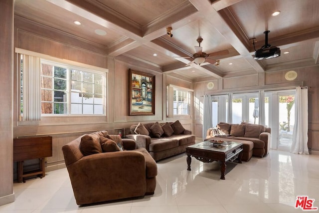 tiled living room featuring ceiling fan, beamed ceiling, wood walls, and coffered ceiling