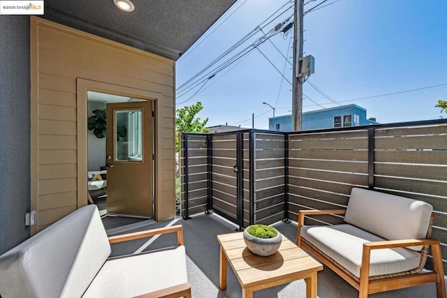 view of patio featuring a balcony