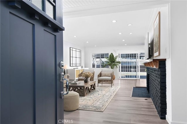 living room featuring hardwood / wood-style flooring and a fireplace