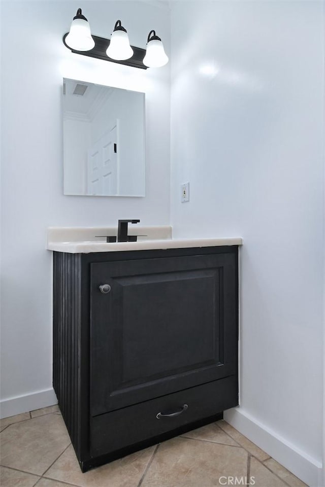 bathroom with tile patterned flooring and vanity