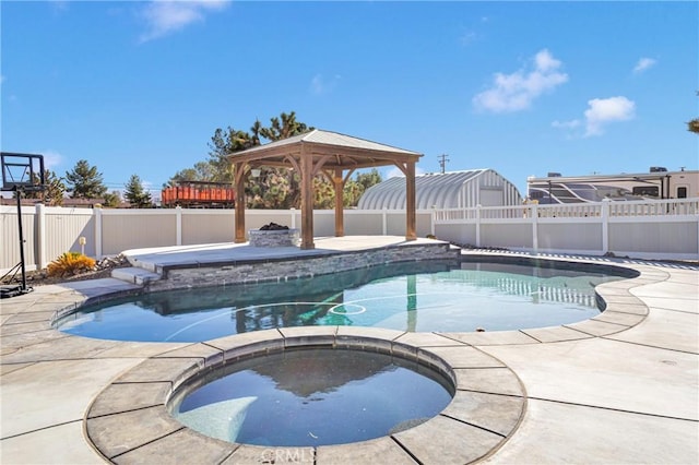 view of swimming pool featuring an in ground hot tub and a gazebo