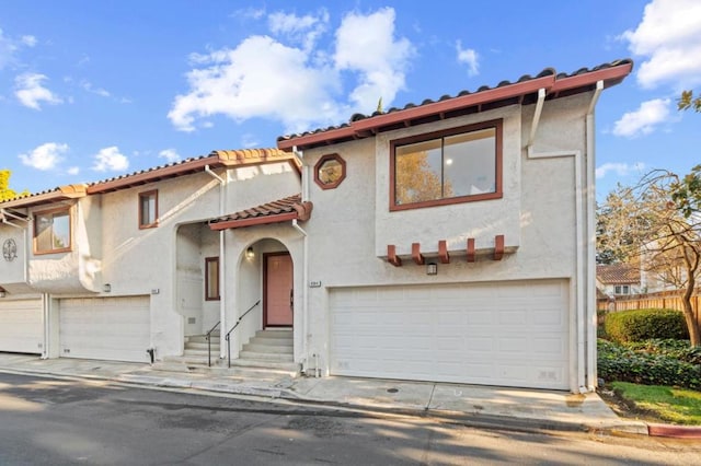 mediterranean / spanish-style home featuring a garage