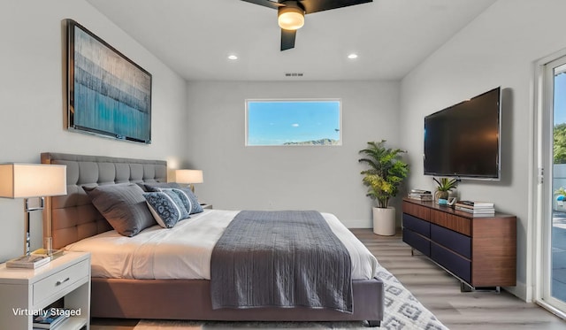 bedroom featuring ceiling fan, access to exterior, and light hardwood / wood-style flooring