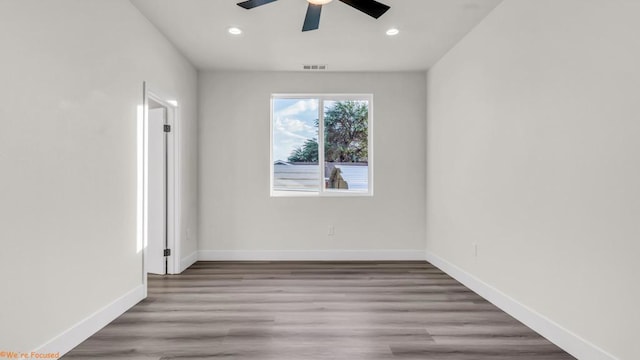 unfurnished room featuring ceiling fan and light wood-type flooring