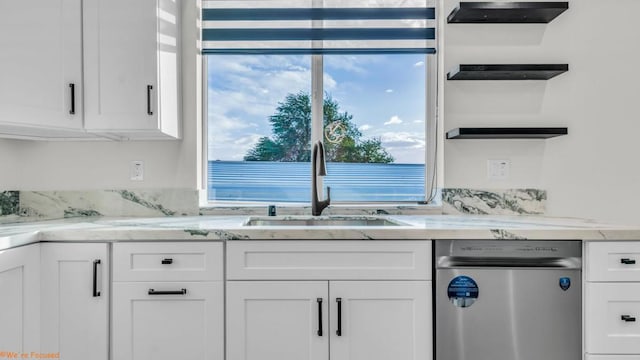 kitchen featuring sink, white cabinetry, dishwasher, and a wealth of natural light