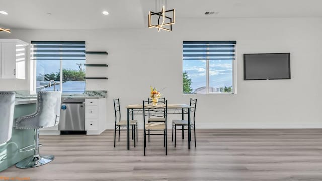 dining room featuring light hardwood / wood-style flooring