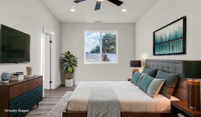 bedroom featuring ceiling fan and light hardwood / wood-style floors