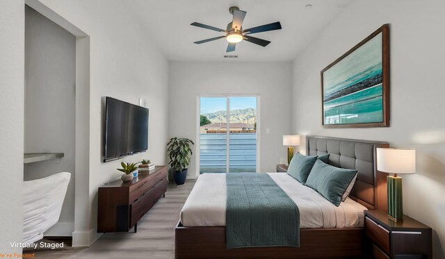 bedroom featuring ceiling fan and light hardwood / wood-style floors