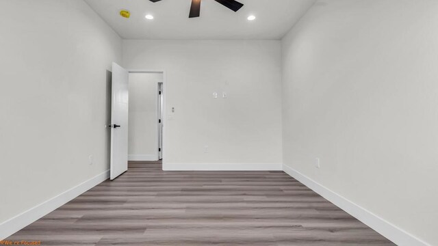 unfurnished room with ceiling fan and light hardwood / wood-style floors