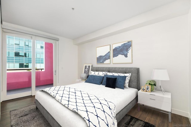 bedroom featuring dark hardwood / wood-style flooring and access to outside