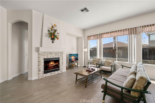 living room with a fireplace and hardwood / wood-style flooring