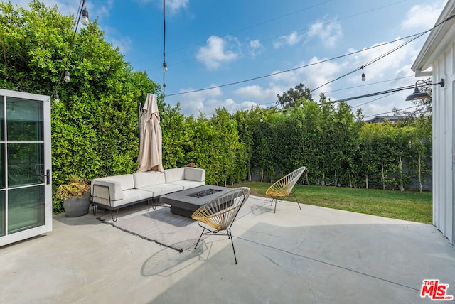 view of patio / terrace featuring an outdoor living space with a fire pit