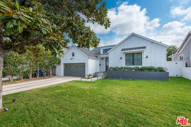 modern farmhouse with a garage and a front yard