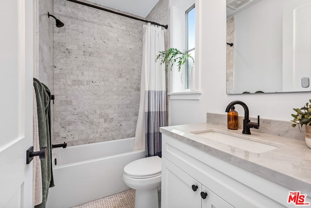 full bathroom with toilet, vanity, and shower / bath combination with curtain