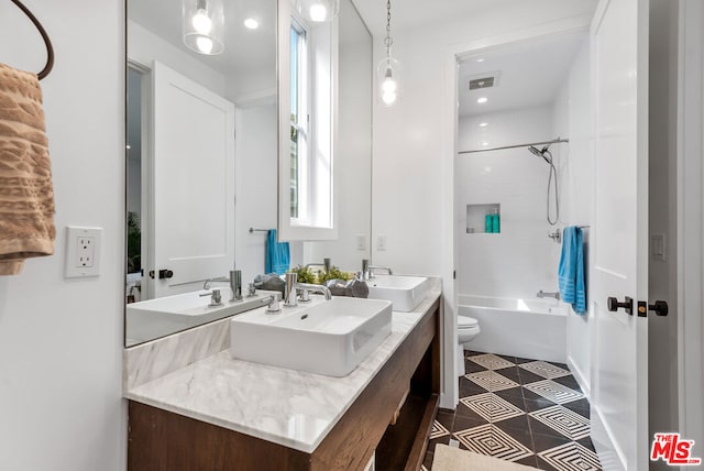 full bathroom with toilet, vanity, tub / shower combination, and tile patterned flooring