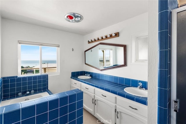 bathroom featuring vanity and a water view