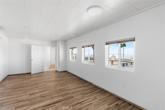 unfurnished room featuring light wood-type flooring