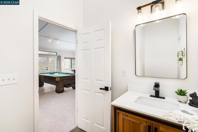 bathroom featuring vanity, french doors, and pool table