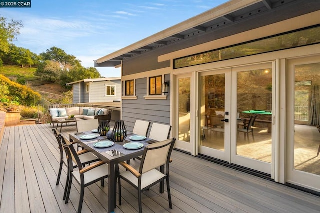 deck with an outdoor hangout area and french doors