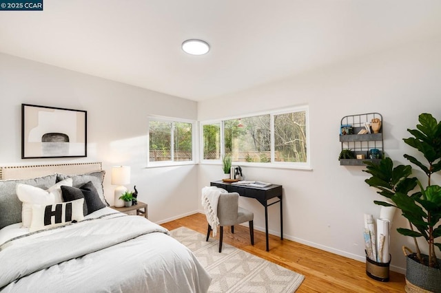 bedroom with light wood-type flooring