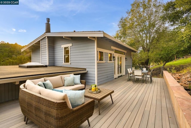 wooden deck featuring outdoor lounge area