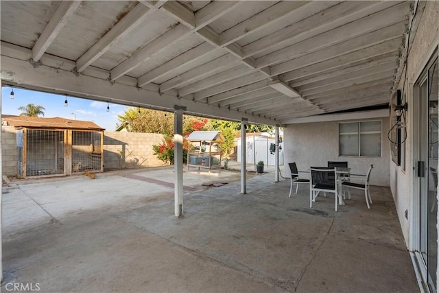 view of patio featuring a shed