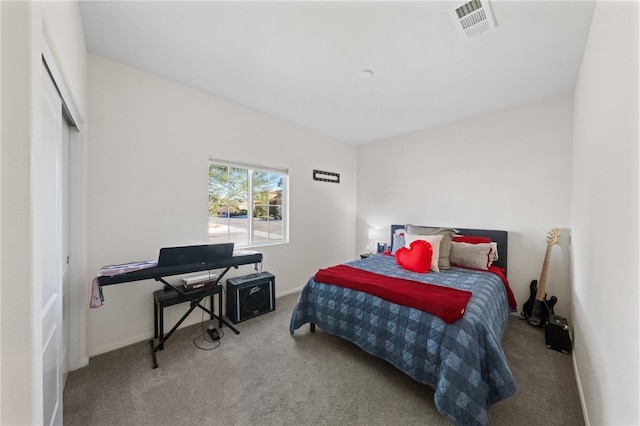 carpeted bedroom featuring a closet