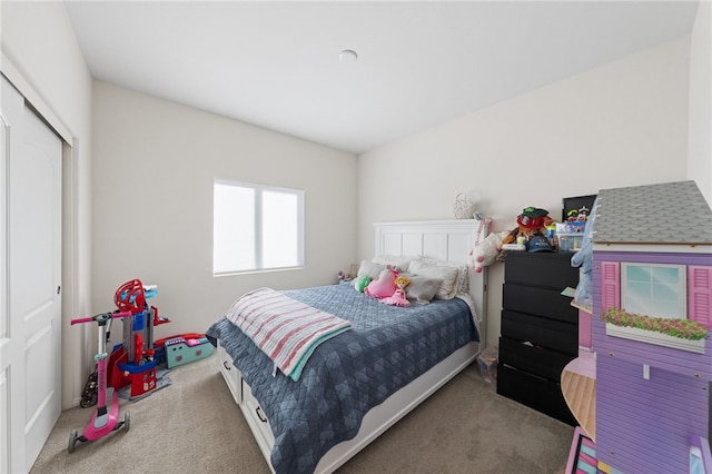 bedroom with a closet and carpet flooring