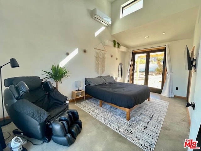 bedroom featuring access to outside and a wall mounted AC