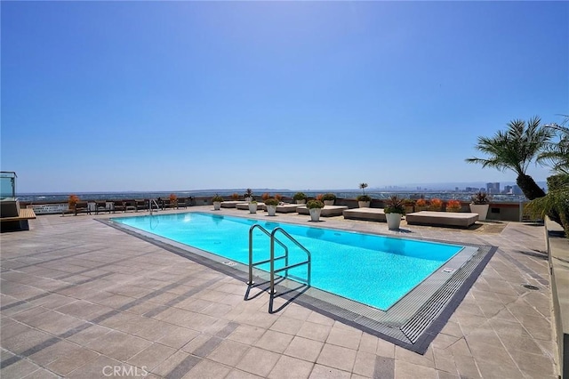 view of swimming pool featuring a patio