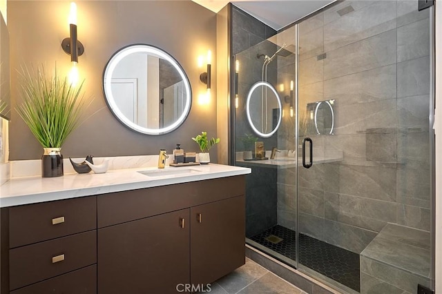 bathroom with an enclosed shower and vanity