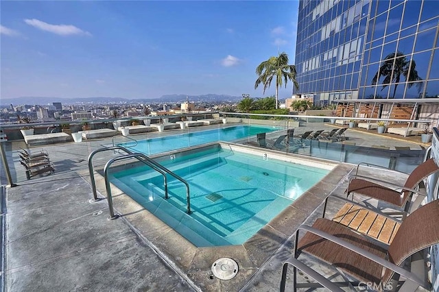 view of pool featuring a hot tub