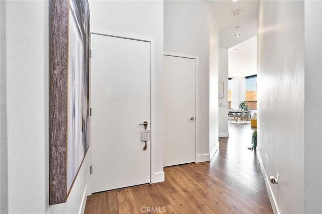 corridor featuring hardwood / wood-style floors