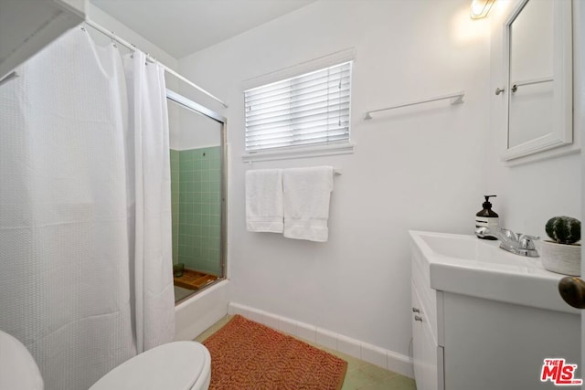 full bathroom with toilet, shower / tub combo, tile patterned floors, and vanity