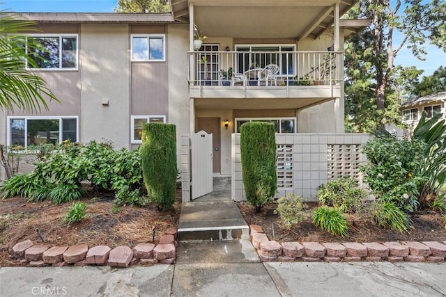 view of front of property with a balcony