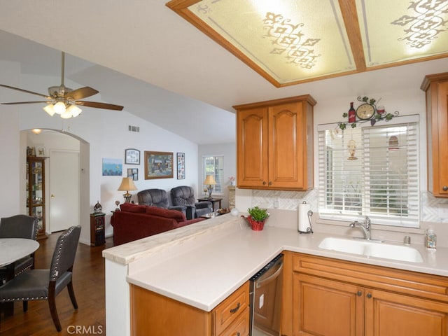 kitchen with ceiling fan, kitchen peninsula, dishwasher, and sink