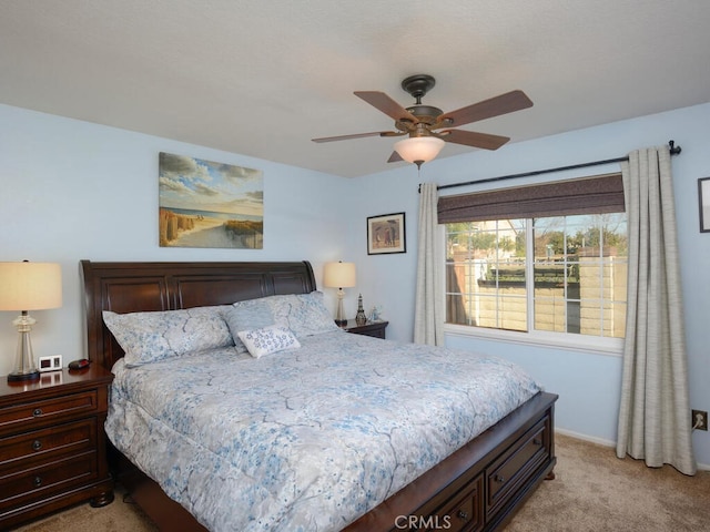 bedroom with ceiling fan and light colored carpet