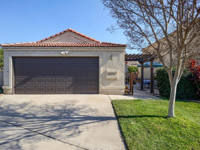 mediterranean / spanish home with a garage