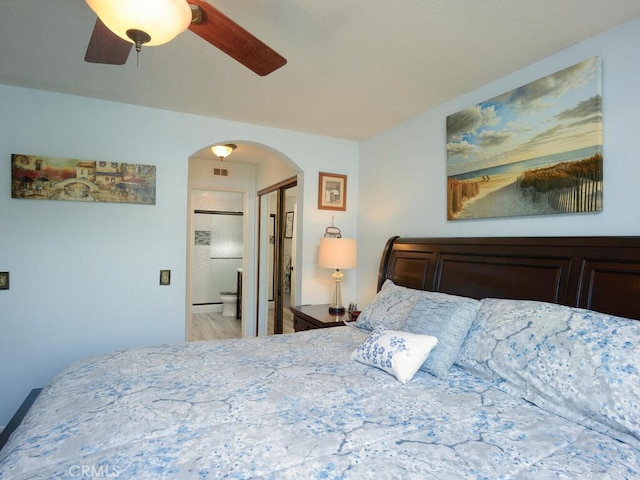 bedroom featuring ceiling fan and connected bathroom