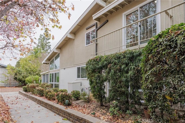 view of side of property with a patio area