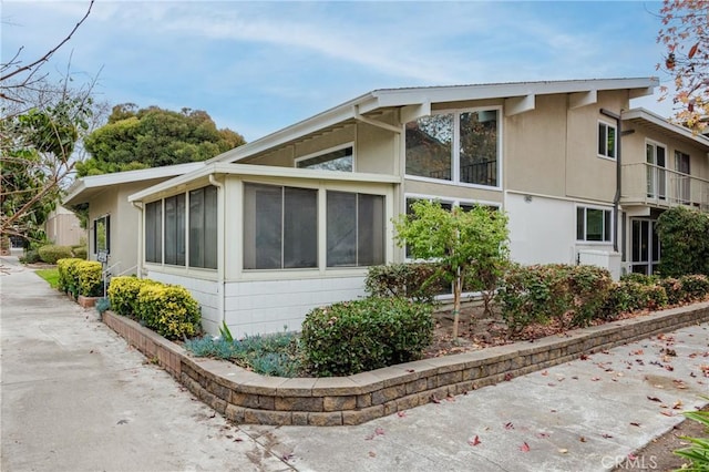 view of home's exterior featuring a sunroom