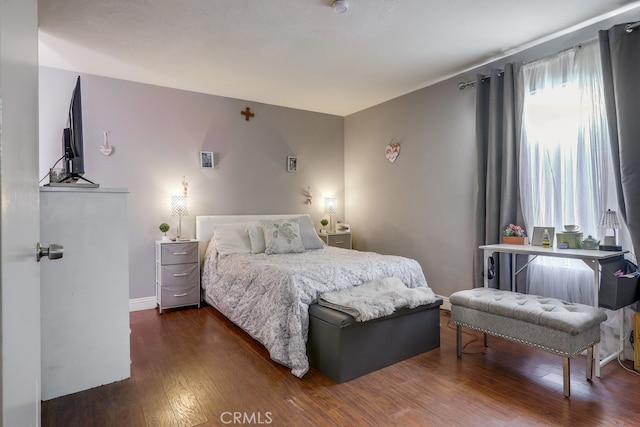 bedroom featuring dark wood-type flooring