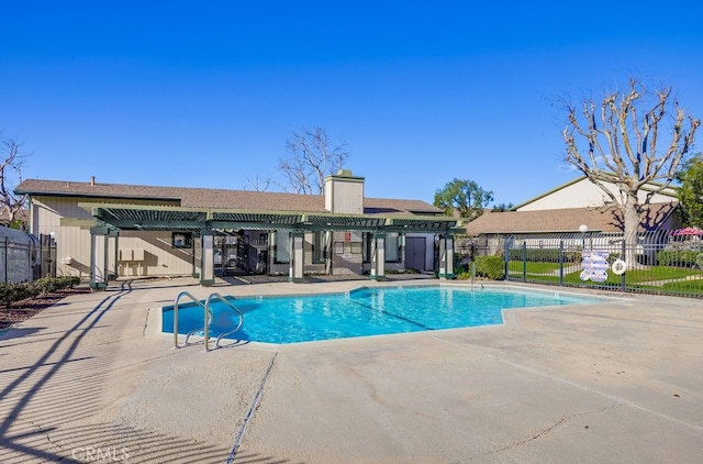 view of swimming pool with a pergola and a patio